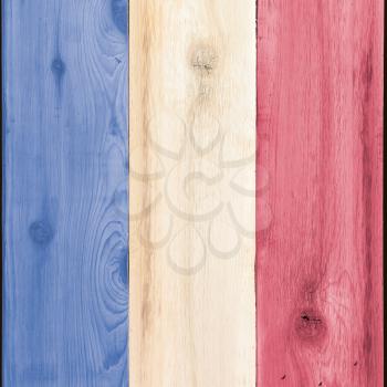 Timber planks of wood that have been painted or stained in the colors of a flag as a background for France or USA