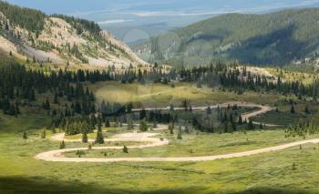Series of bends on unfinished or dirt road climbing to top of Cottonwood Pass in Colorado