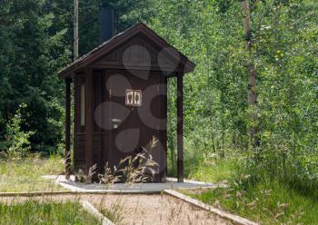 Wooden restroom or toilet building in remote forest in National park in USA