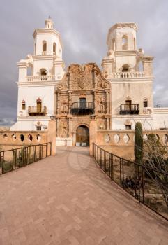 Early mission of San Xavier del Bac known as White Dove in Desert on a cloudy day near Tucson Arizona