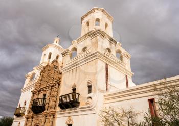 Early mission of San Xavier del Bac known as White Dove in Desert on a cloudy day near Tucson Arizona