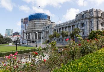 New Zealand Parliament government building known as Beehive in Wellington with Parliament House in foreground