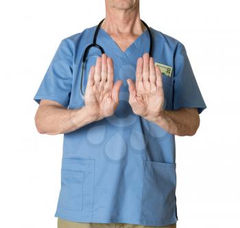 Senior caucasian doctor in scrubs refusing entry  for treatment and isolated against white background
