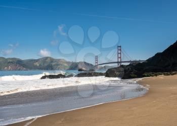 Marin Headlands with the Golden Gate Bridge taken from Baker Beach in San Francisco on clear spring day