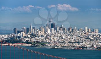 Telefoto image of the suspension of Golden Gate Bridge and San Francisco taken from Marin Headlands on clear spring day