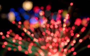 Defocused bokeh of christmas tree lights to be used as abstract background for holiday image