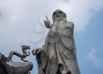 Small dragon by statue of Lao Tze by Temple of Tai Qing Gong at Laoshan near Qingdao China