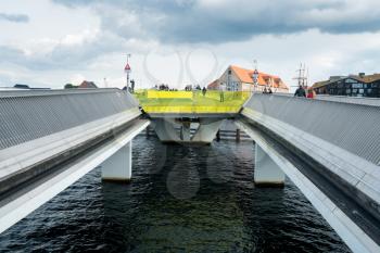 COPENHAGEN, DENMARK - SEPTEMBER 18: Pedestrians on Inderhavnsbroen on September 18, 2017 in Copenhagen. The bridge was opened in 2016.