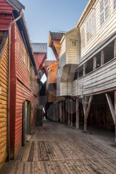Narrow passageways between warehouses in Bryggen district in the center of Bergen, Norway