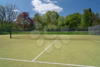 Detail of the net and lines on a tennis court on outdoor artificial grass surface
