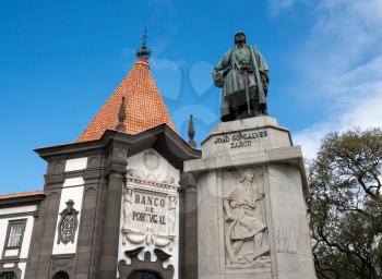 FUNCHAL, MADIERA - MARCH 12, 2018: Statue of Zarco and Banco de Portugal in Funchal on island of Madiera