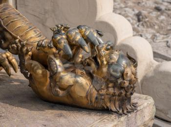 Details of the lion statue with cub by Supreme Harmony Palace in the Forbidden City in Beijing