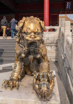 Details of the lion statue with cub by Supreme Harmony Palace in the Forbidden City in Beijing