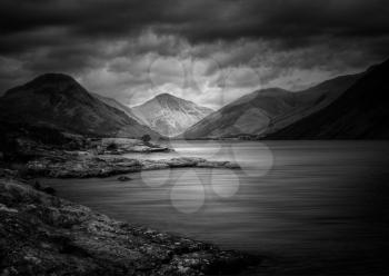 Wastwater or Wast Water in English Lake District on cloudy day in dark and moody or forbidding Black and White treatment