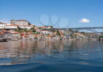 Cityscape of Porto from the banks of the river Douro with artificial water