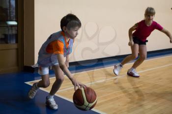 Russia, Volgodonsk - June 02, 2015: Children are trained to play basketball