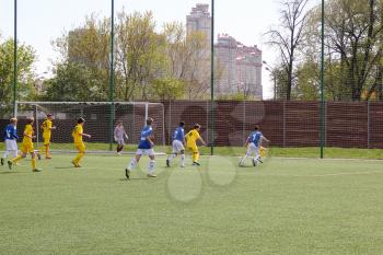 Football game. Training matches junior teams and fans.
