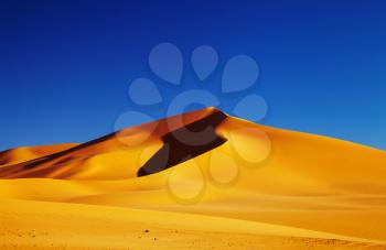 Sand dune in Sahara Desert at sunset, Tadrart, Algeria
