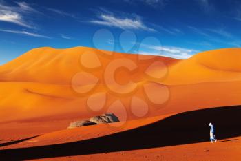 Tuareg in desert at sunset, Sahara Desert, Algeria
