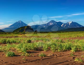 Mountain landscape with volcanoes and blue sky, Kamchatka