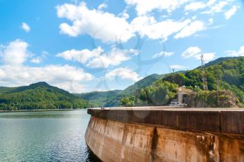 Vidraru artificial lake and dam on Arges river in Transylvania, Romania.  Fagaras ridge in the Carpathian mountains. Hydro electric power station