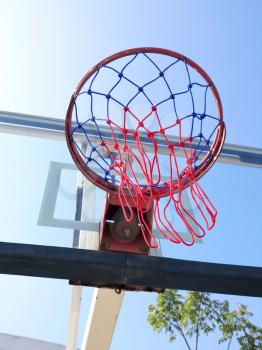 Basketball net on blue sky background