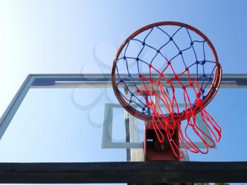 Basketball net on blue sky background