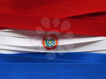 Paraguay flag or banner made with red, blue and white ribbons