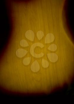back of the lacquered wooden guitar soundboard