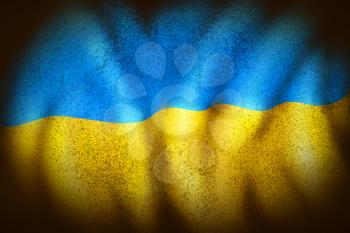 curly Ukrainian flag in dark colors and grungy stains.