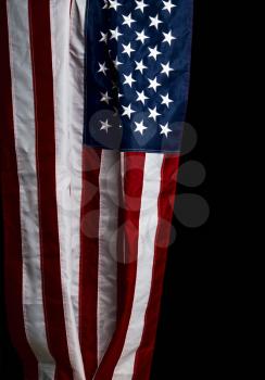 beautiful star stripped US flag hanging on a dark background