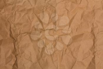 background with a blank spot of heavily crumpled beige paper