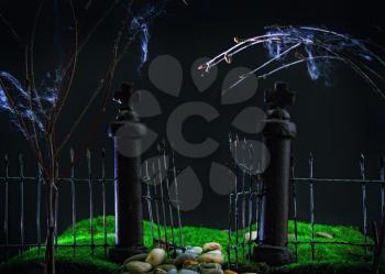 old gloomy rickety iron gate into an abandoned garden with green grass view at night. Toy model