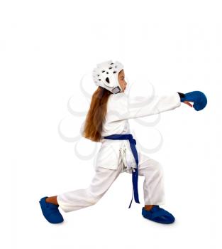karate girl in a white kimono and a helmet and a blue outfit consisting of a belt of gloves and a foot practices striking