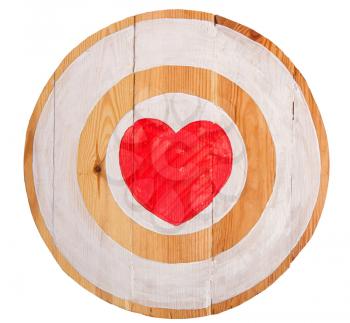 Vintage homemade wooden round target with red heart in center on white background 