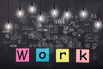 Business concept - word ' Work ', sketch with schemes and graphs on chalkboard