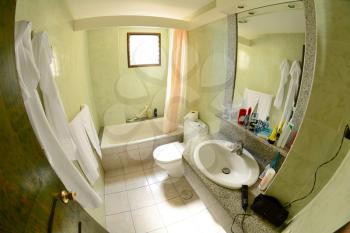 Hotel bathroom with appliance and cosmetic equipment.