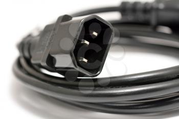 Black power cord with detail on the C14 (IEC320) connector on a white background.