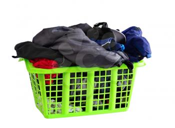 Green basket full of fresh washed laundry isolated on white background.