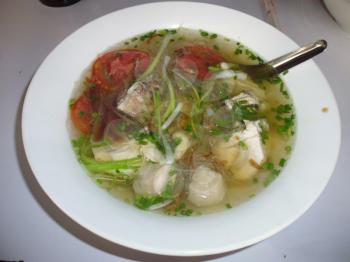 Thai soup with meat balls and rice noodles close up. top view of a horizontal