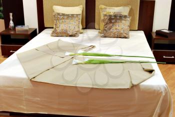 Bedroom with calla lily flower on bed