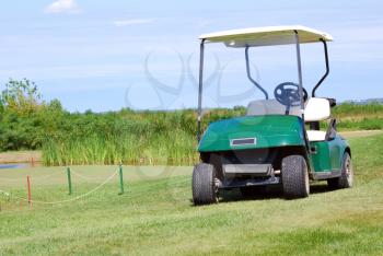 golf buggy on green grass field