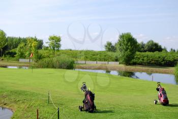 Golf field with two golf bag