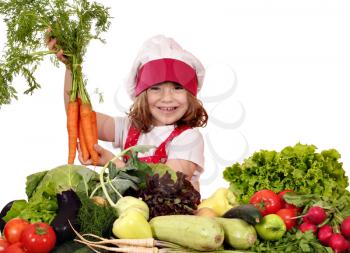 happy little girl cook holding carrot 