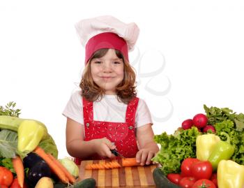little girl cook cutting carrot 