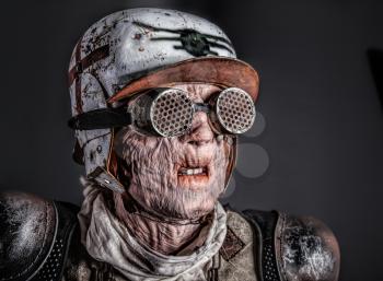 Post apocalyptic survivor masked ugly face. Skin burned by atomic flame
