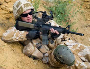 British soldier in desert uniform in action
