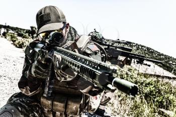 Commando team fighters, special operations or anti terrorist squad snipers, marksman aiming guns through optical signs, hiding in ambush, observing territory. Service rifle barrel closeup shoot