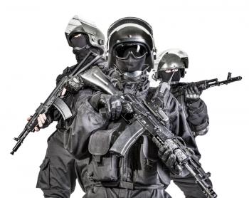 Russian special forces operators in black uniform and bulletproof helmets