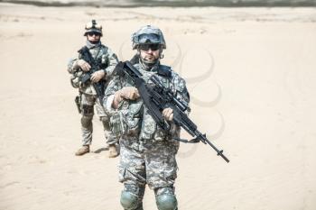 United states airborne infantry men with arms, camo uniforms dress. Front view